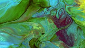 Verical Close-up shot of multi-colored paint mixture boiling in a mixer. They form a unique abstraction that can be used in many video projects and background.