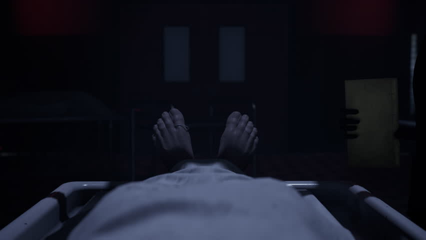 Two doctors standing in fron of a corpse in the morgue and ready to execute an autopsy