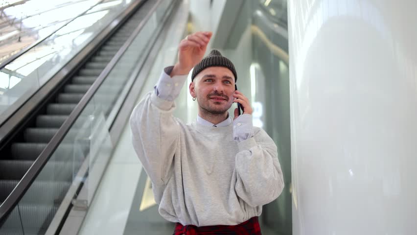 man waving at the airport