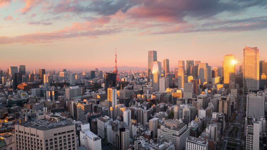 tokyo city downtown aerial view timelapse from night to day minato ward district,high point of view time lapse of modern urban town business buildings and skyscrapers