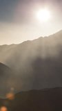 timelapse of atlas mountains with fog and mist landscape in the sahara, morocco in vertical