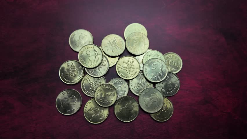 Indian Currency -  5 Rupee Coins - Backwards Shot. Royalty-Free Stock Footage #3444825083