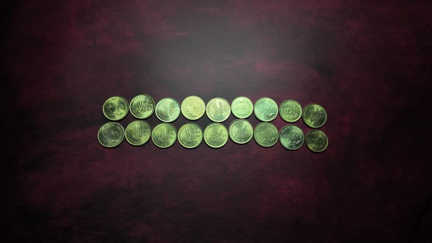 Indian Currency -  5 Rupee Coins - Revealing Shot. Royalty-Free Stock Footage #3444828047