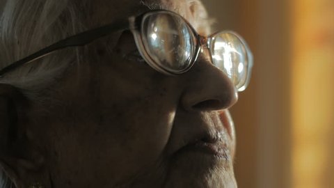 scratched old vintage eye glasses and wrinkled lips, Indian old woman. tight close up of face