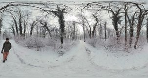 Embark on a captivating journey through a serene winter forest in this 360-degree virtual reality video. The soft crunch of snow underfoot and the gentle of bare branches in the wind create an