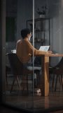 Vertical Format Video of a Young Latin Marketing Specialist Working on Laptop Computer in Busy Creative Office Environment. Beautiful Diverse Multiethnic Female Project Manager Making a Presentation.