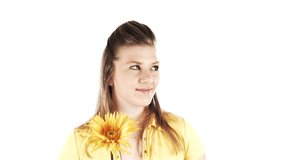 girl holding a flower, looking left to right with flowers popping on each side