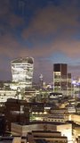london city skyline from a high vantage point timelapse at night in vertical