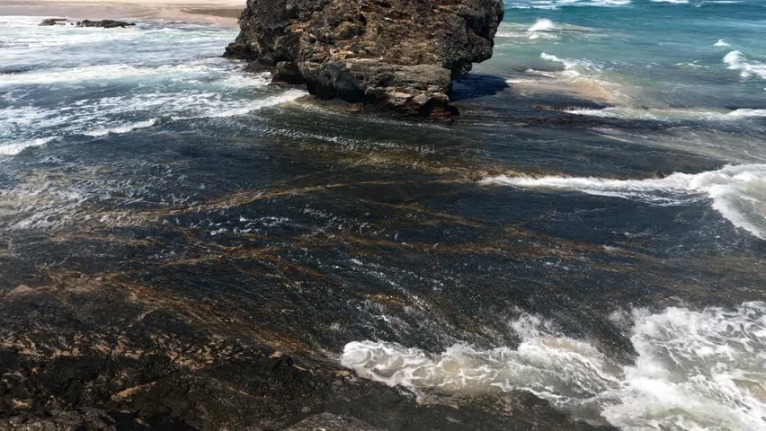 Rock Formation On The Shore Of Currumbin Alley In Gold Coast, QLD, Australia. tilt-up revealing shot