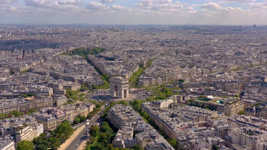 PARIS, FRANCE - MAY 30, 2023: Aerial view over Triumphal Arc traffic in central Paris cityscape. Famous touristic landmark, world heritage of architectural masterpieces. Royalty-Free Stock Footage #3445140815