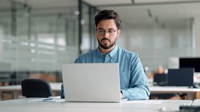 Busy professional business man company employee, young male worker software developer, latin businessman looking at computer thinking on online investment management using laptop working at office. - Powered by Shutterstock - Get 15% off with code: PIKWIZARD15