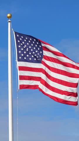 American flag raised on a sunny day. USA vertical flag Royalty-Free Stock Footage #3445221053