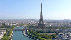PARIS, FRANCE - MAY 30, 2023: Aerial view of Tour Eiffel Tower and Seine River bridge and historical city center. Famous touristic landmark, world heritage of architectural masterpieces - Powered by Shutterstock - Get 15% off with code: PIKWIZARD15