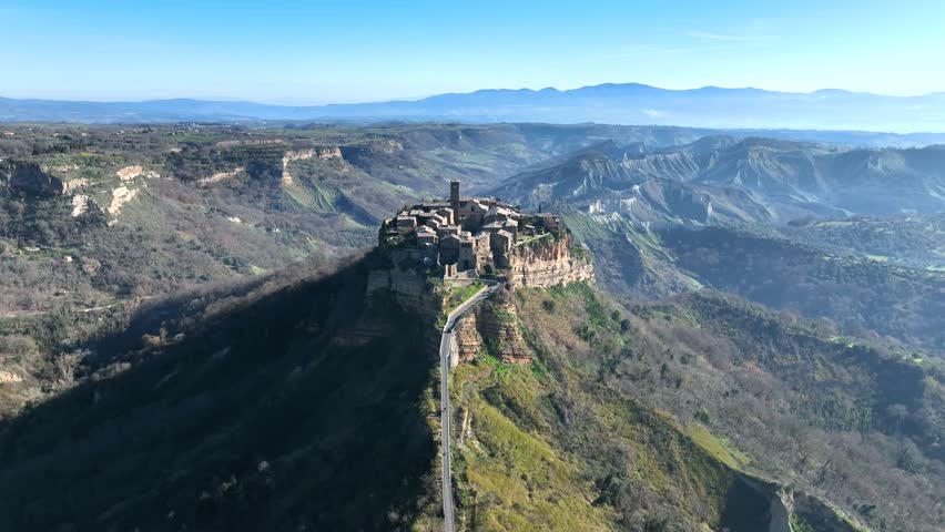 Civita di Bagnoregio, a medieval tourist village on the tuff hill. Viterbo, Lazio Italy.
Aerial view of Bagnoregio, the city that is dying due to the crumbling volcanic rock, Calanchi.