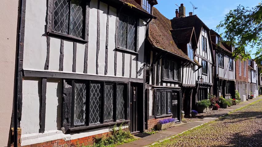 Walking motion through a quaint English town with half timbered houses, East Sussex, UK Royalty-Free Stock Footage #3445311511