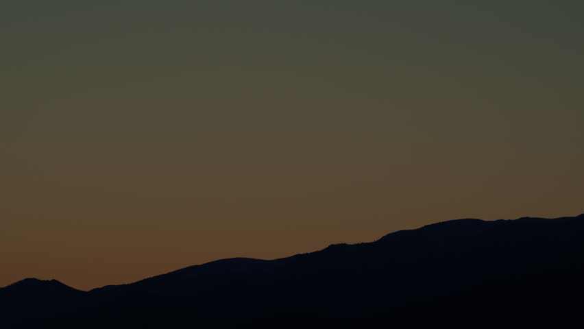 Sunset Landscape View Of Silhouette Mountains. Hills In Sunlight. Mountain Silhouette.