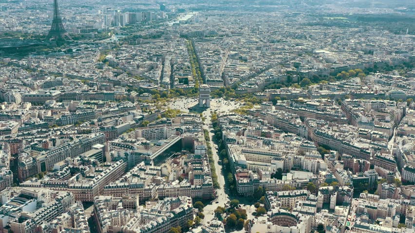 PARIS, FRANCE - MAY 30, 2023: Aerial view over Triumphal Arc traffic in central Paris cityscape. Famous touristic landmark, world heritage of architectural masterpieces. Royalty-Free Stock Footage #3445322469