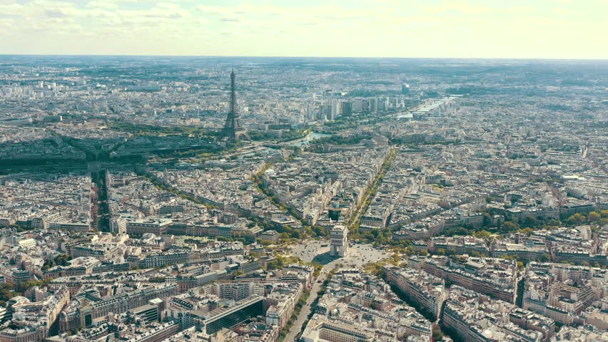 PARIS, FRANCE - MAY 30, 2023: Aerial view over Triumphal Arc traffic in central Paris cityscape. Famous touristic landmark, world heritage of architectural masterpieces. Royalty-Free Stock Footage #3445324227