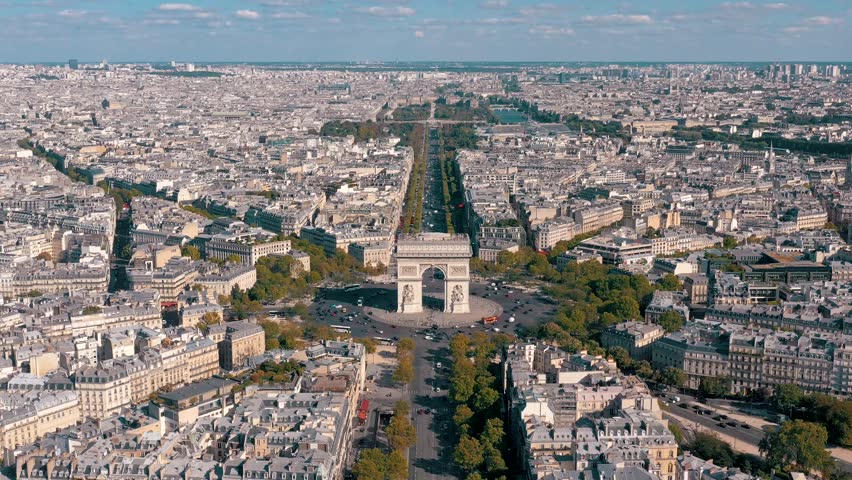 PARIS, FRANCE - MAY 30, 2023: Aerial view over Triumphal Arc traffic in central Paris cityscape. Famous touristic landmark, world heritage of architectural masterpieces. Royalty-Free Stock Footage #3445347707
