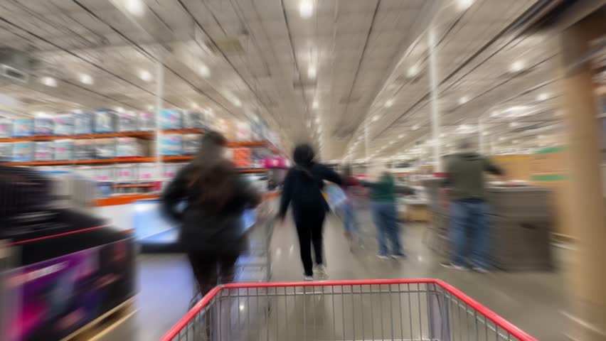 A time lapse view walking through the aisles of a large big box store.  	 Royalty-Free Stock Footage #3445349583