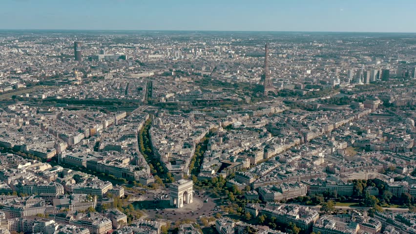 PARIS, FRANCE - MAY 30, 2023: Aerial view over Triumphal Arc traffic in central Paris cityscape. Famous touristic landmark, world heritage of architectural masterpieces. Royalty-Free Stock Footage #3445362001