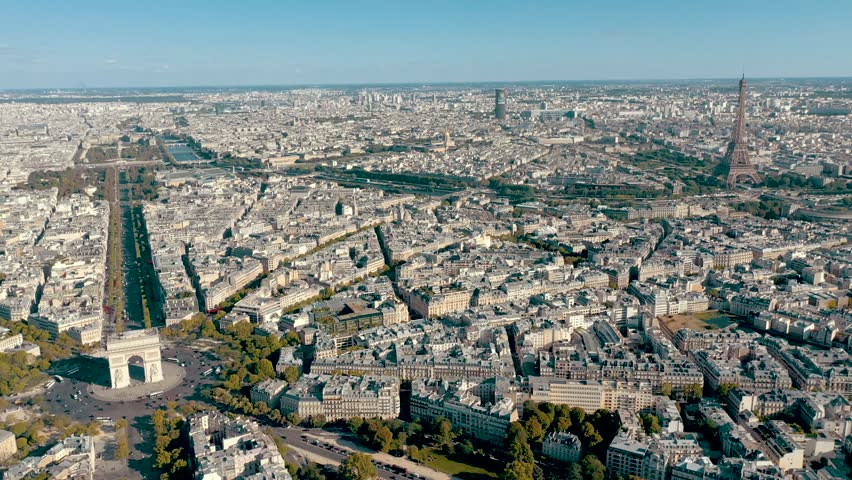 PARIS, FRANCE - MAY 30, 2023: Aerial view over Triumphal Arc traffic in central Paris cityscape. Famous touristic landmark, world heritage of architectural masterpieces. Royalty-Free Stock Footage #3445371167