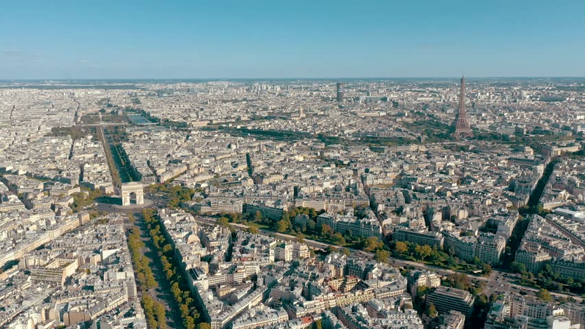 PARIS, FRANCE - MAY 30, 2023: Aerial view over Triumphal Arc traffic in central Paris cityscape. Famous touristic landmark, world heritage of architectural masterpieces. Royalty-Free Stock Footage #3445372577