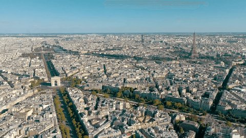 PARIS, FRANCE - MAY 30, 2023: Aerial view over Triumphal Arc traffic in central Paris cityscape. Famous touristic landmark, world heritage of architectural masterpieces.の動画素材