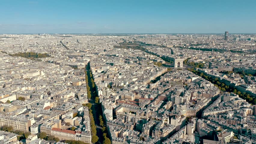 PARIS, FRANCE - MAY 30, 2023: Aerial view over Triumphal Arc traffic in central Paris cityscape. Famous touristic landmark, world heritage of architectural masterpieces. Royalty-Free Stock Footage #3445373147