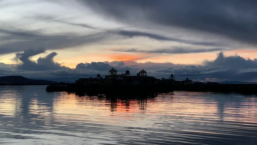 Sunset sky dramatc clouds above Lake Titicaca in Peru at night.