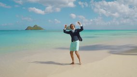 Young joyful man enjoying long awaited holidays in amazing Hawaii, dancing barefoot on golden sunny beach with pure turquoise waters of the Pacific ocean. High quality 4k footage - Powered by Shutterstock - Get 15% off with code: PIKWIZARD15