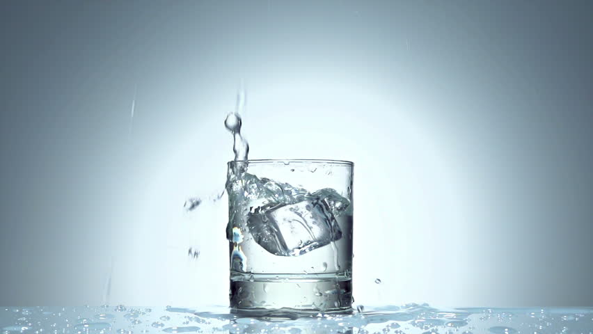 ice cube splash in glass of water on white, slow motion 250fps fullHD video