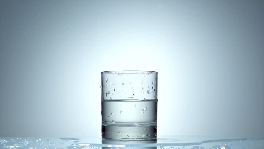 ice cube splash in glass of water on white, slow motion 250fps fullHD video