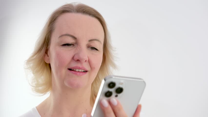 Stressed nervous woman looking at cellphone screen, feeling frustrated of receiving message or email with bad news. Unhappy millennial female user dissatisfied with bad electronic device work Royalty-Free Stock Footage #3445498039