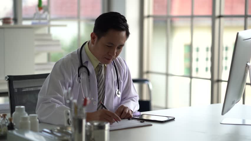 Doctor reads patient's treatment results To inform the patient Royalty-Free Stock Footage #3445518867