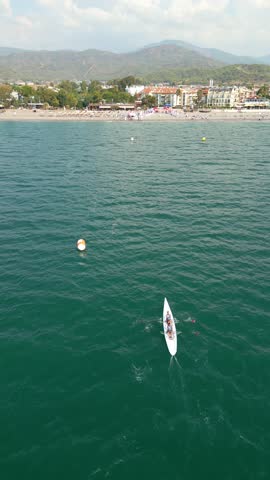 Sport Canoe rowing on tranquil water, Aerial view.rowing beach sprint race 