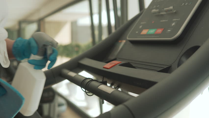 Cleaning And Disinfecting Exercise Machines In The Gym Royalty-Free Stock Footage #3445633907