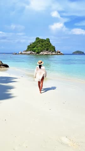 Asian Thai women walking at the beach of Koh Lipe Satun Thailand. Thai girl on the beach of Koh Lipe tropical island Royalty-Free Stock Footage #3445651877