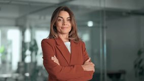 Smiling confident 45 years old Latin professional middle aged business woman corporate leader, happy mature female executive, lady manager standing in office looking at camera, portrait. - Powered by Shutterstock - Get 15% off with code: PIKWIZARD15