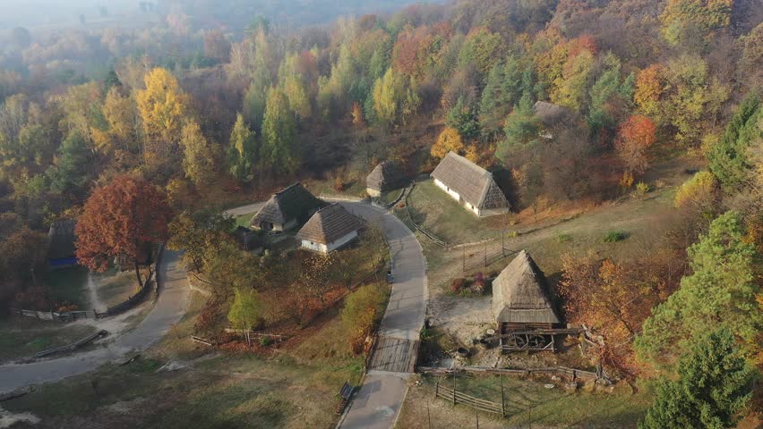 Beautiful autumn landscapes of the Ukrainian village. Aerial view. Ukraine small village at sunrise fog in summer time. Drone view of beautiful landscape. Ukrainian landmarks. Royalty-Free Stock Footage #3445745081