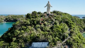 Statue of Jesus Christ on Pilgrimage Island at Hundred Islands National Park, Alaminos, Pangasinan, Philippines. Footage shot in 4k video 30fps.