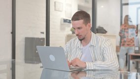 Creative Young Man Shocked by Loss on Laptop - Powered by Shutterstock - Get 15% off with code: PIKWIZARD15