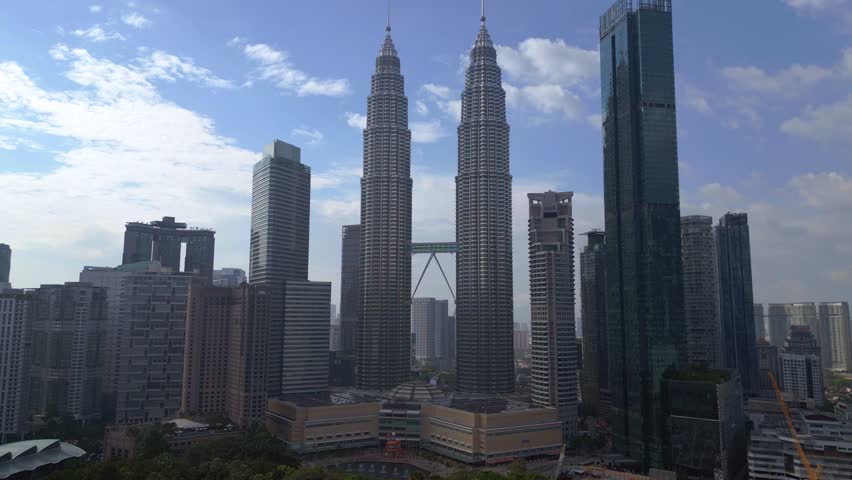 twin towers city skyscraper Kuala Lumpur malaysia Dramatic aerial view drone