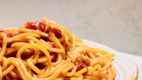 Classic spaghetti in tomato sauce, slow motion video