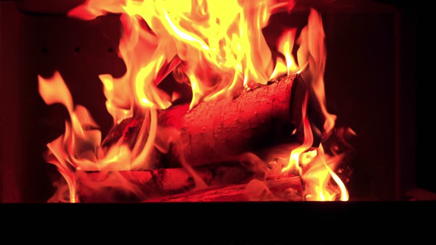 Close-up view of a fireplace in a house with burning wood and the crackling sound of the fire. Royalty-Free Stock Footage #3446066759