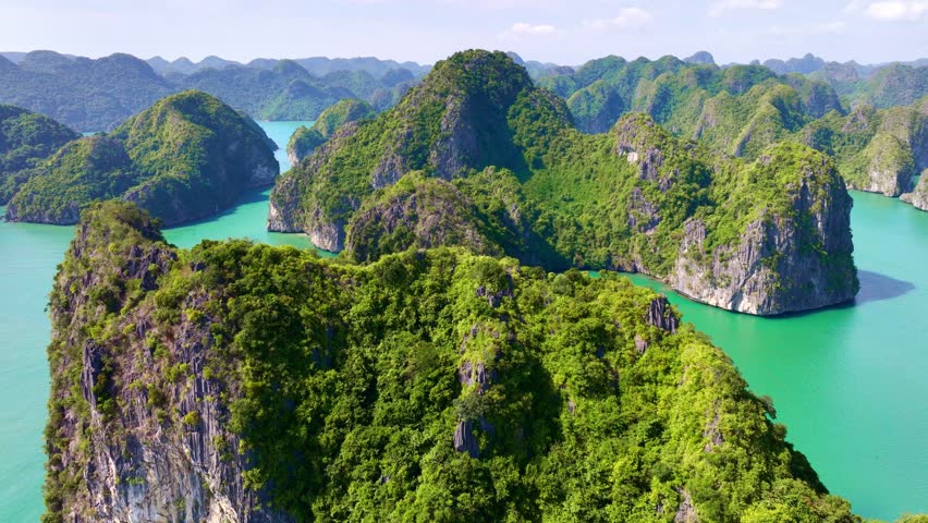 scenic drone shot of Unesco World Heritage sight, Halong Bay in Vietnam, iconic Halong Islands drone shot. Vacation travel in Vietnam