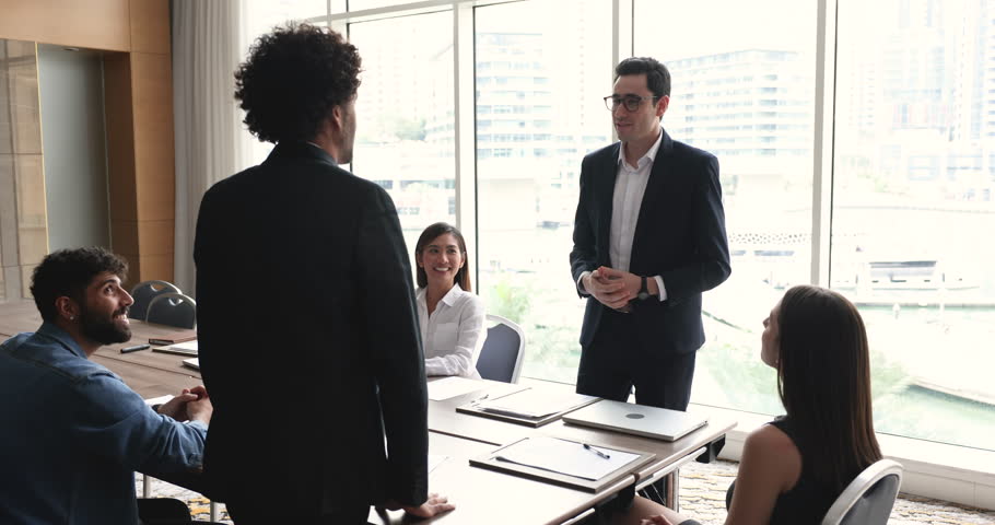 Two smiling businessmen leaders in formal suits shake hands finish meeting in office with partners, closing commercial profitable deal, express respect for good job and cooperation. Business etiquette Royalty-Free Stock Footage #3446170349