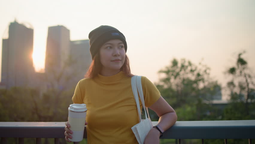 Go green Gen Z woman asia young people looking away in city life nature tree public park reuse cup eco tote bag save the earth world care reduce issues asian future hope net zero waste the way forward Royalty-Free Stock Footage #3446193125