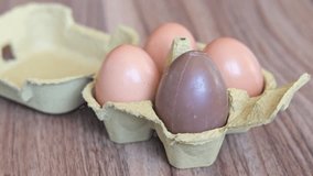 Easter eggs in a cardboard box. One chocolate egg	 - Powered by Shutterstock - Get 15% off with code: PIKWIZARD15
