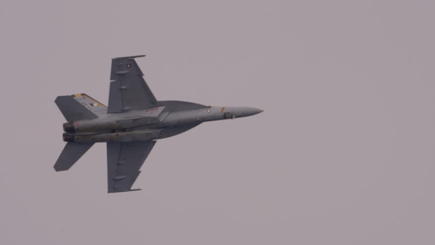 Gray Colored Fighter Plane Flying In Cloudy Sky During Pacific Airshow - Huntington Beach, California